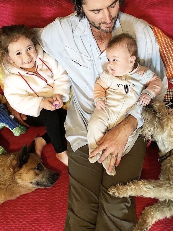 Bliss: Luke Evans with daughters Elle and Evie, his own dog Tilly (left) and an overnighter. Dogs that stay over join the family.