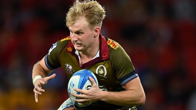 BRISBANE, AUSTRALIA - APRIL 27: Tom Lynagh of the Reds is tackled by Anton Segner of the Blues during the round 10 Super Rugby Pacific match between Queensland Reds and Blues at Suncorp Stadium, on April 27, 2024, in Brisbane, Australia. (Photo by Albert Perez/Getty Images)