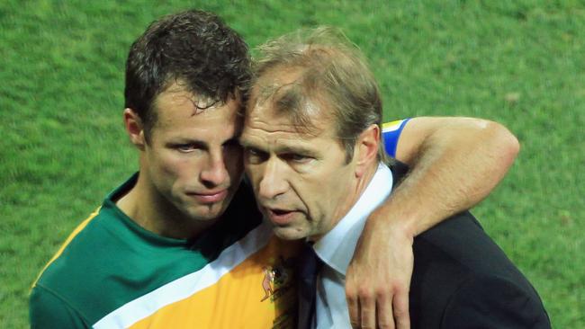 Verbeek with defender Lucas Neill after the Socceroos were eliminated from the 2010 World Cup in South Africa. Picture: Getty Images