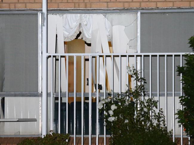 Home invasion: The front window of the Badgerys Creek home was smashed in. Photo: Bill Hearne