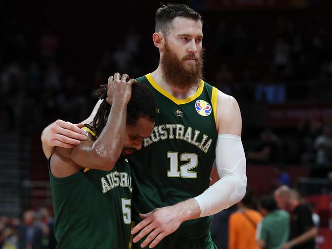 Aron Baynes with Patty Mills of Australia reacts after the loss to Spain in 2019. Photo: Lintao Zhang/Getty Images.