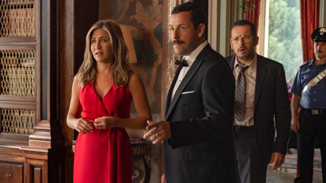 While Aniston is quite at ease with the low-level intrigue of the case at hand, Sandler mostly just stands there and says something sort of crass, ignorant or both.