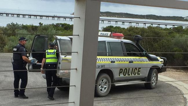 Police at Marion Bay after holidaymakers found a suspected block of cocaine in a bag washed up on the beach.