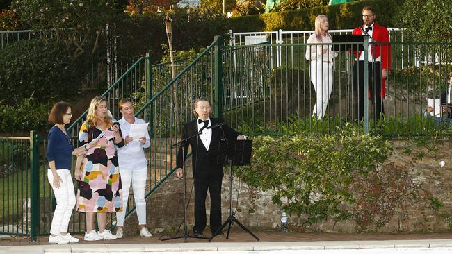 L to R: Tracy Zietsch, Nicola Paulsen, Zoe Paulsen, Stuart Shaw, Lidia Stojanovski and Ashley Wales-Brown lead the singing from the pool area. Picture: John Appleyard