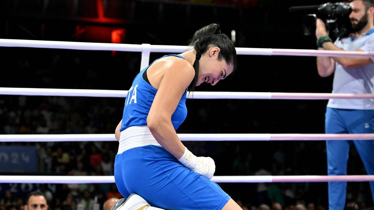 TOPSHOT - Italy's Angela Carini reacts during her women's 66kg preliminaries round of 16 boxing match against Algeria's Imane Khelif during the Paris 2024 Olympic Games at the North Paris Arena, in Villepinte on August 1, 2024. (Photo by MOHD RASFAN / AFP)