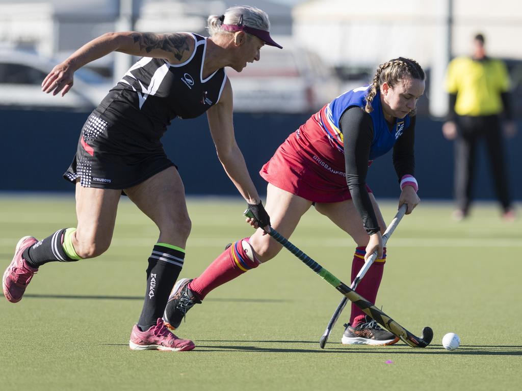 Mackay 1 player Tammie Clark (left) and Amanda Gray of Brisbane 2.