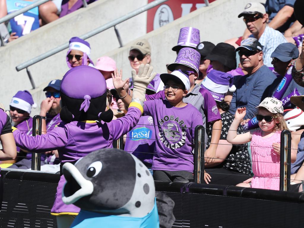 Fans enjoying the hot weather at the Big Bash match between the Hurricanes and Melbourne Stars at Blundstone Arena on Christmas Eve. Picture: LUKE BOWDEN