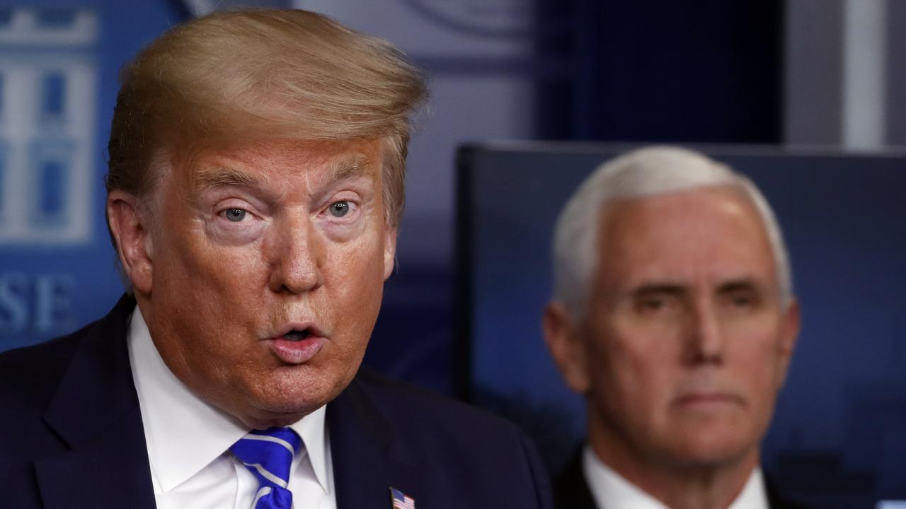 President Donald Trump speaks about the coronavirus as Vice President Mike Pence listens. Picture: AP Alex Brandon