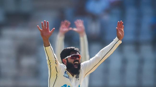 New Zealand's Ajaz Patel celebrates after dismissing India's captain Virat Kohli (not pictured) during the first day of the second Test cricket match between India and New Zealand. Picture: AFP