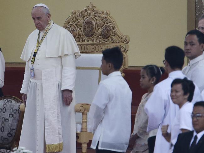 First meeting ... Glyzelle Palomar, third from left, stands with Pope Francis at a meeting of youths at the University of Santo Tomas in Manila. Picture: AP Photo/Aaron Favila