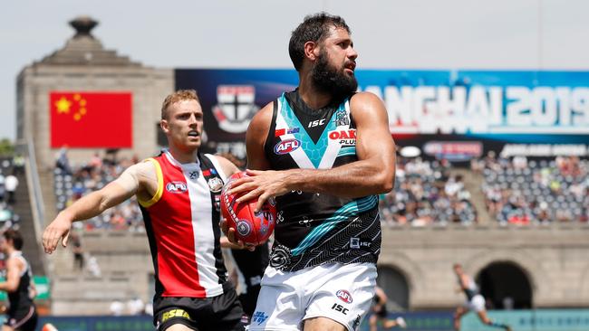 Paddy Ryder of the Power marks in front of Saint Callum Wilkie. Picture: Michael Willson/AFL Photos