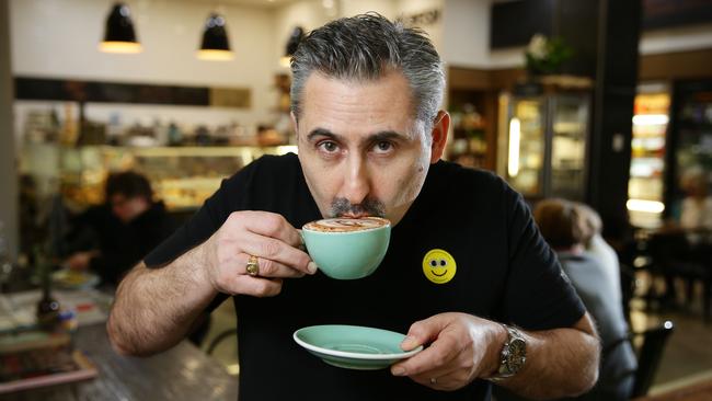 Moreish Food cafe onwer Nick Kiourkas with one of his coffee's at Stockland Balgowlah. Moreish is one of the Sydney Cafes that's donating $1 for each coffee on August 7 to CafeSmart to help homeless people. Picture: Braden Fastier.