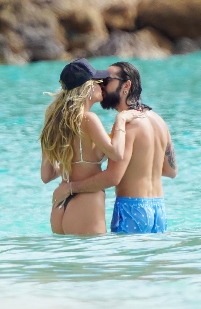 The pair kissed and hugged in the waves as they continued their Caribbean vacation. Picture: EliotPress/MEGA