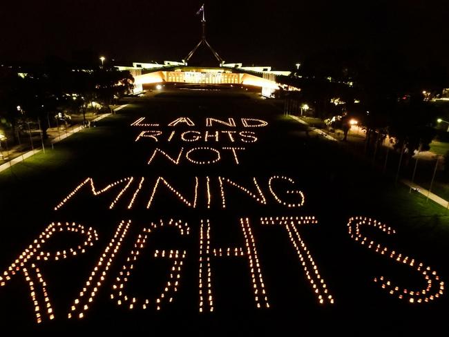 Members of the Seed Youth Indigenous Climate Network gathered on the lawn of Parliament House on Sunday night.