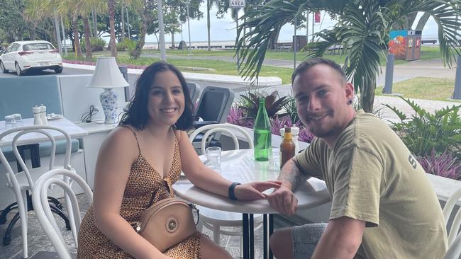 Danielle Gallow from Tolga and Ayden Sue from Mareeba take a break in the Cairns Esplanade outdoor dining precinct. Picture: Andreas Nicola