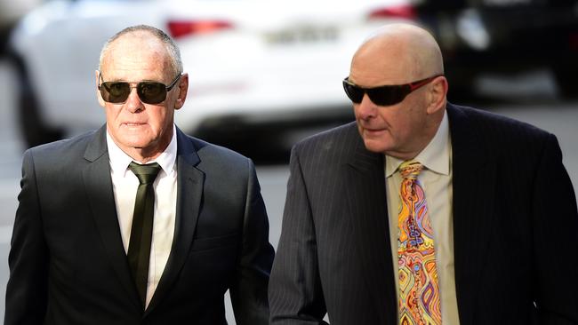 Chris Dawson (left) and brother Peter Dawson (right) arrives at Downing Centre Local Court in June.