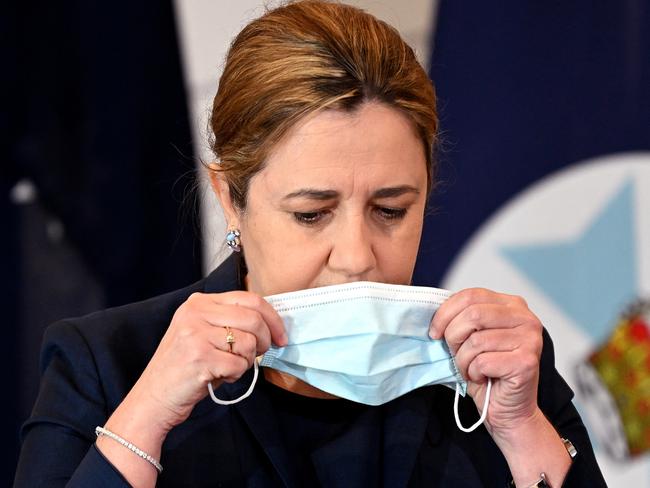 BRISBANE, AUSTRALIA - NewsWire Photos - FEBRUARY 7, 2022.Queensland Premier Annastacia Palaszczuk puts her mask on during a press conference to provide a Covid update.Picture: NCA NewsWire / Dan Peled