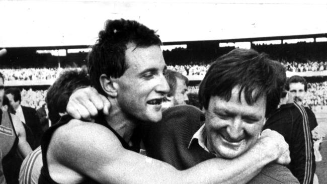 Tim Watson and coach Kevin Sheedy celebrate the 1984 grand final win.