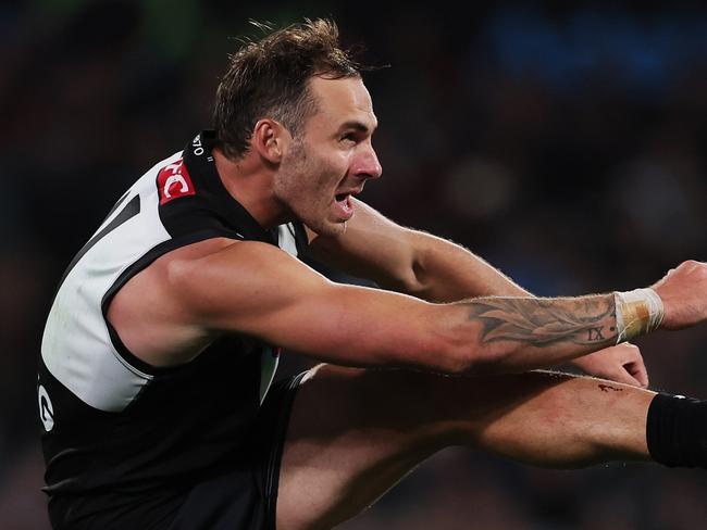 ADELAIDE, AUSTRALIA – APRIL 05: Jeremy Finlayson of the Power kicks the ball during the 2024 AFL Round 04 match between the Port Adelaide Power and the Essendon Bombers at Adelaide Oval on April 05, 2024 in Adelaide, Australia. (Photo by James Elsby/AFL Photos via Getty Images)