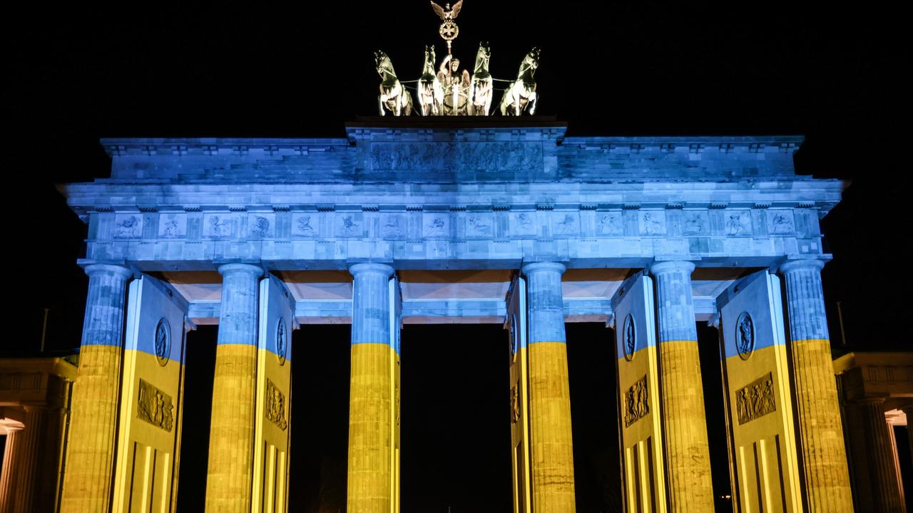 The Brandenburg Gate is lit in the blue and yellow colours of the Ukrainian national flag in solidarity with Ukraine. Picture: Getty Images