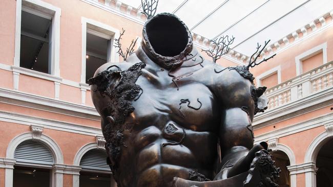 Demon with Bowl by British artist Damien Hirst.