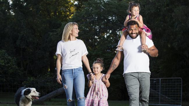 Sam and Rachel Thaiday relax at home with daughters Ellsie 3, and Gracie 5. Photo Lachie Millard