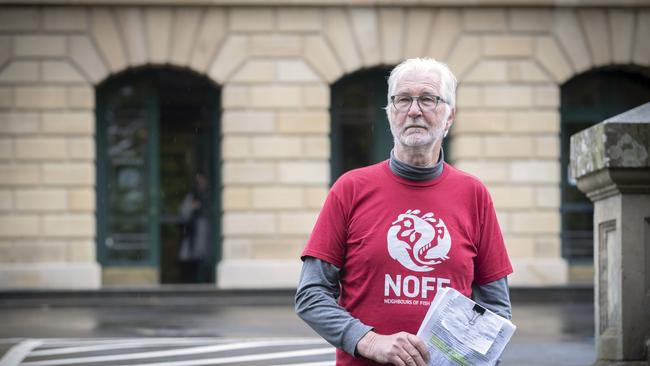 Tasmanian Alliance for Marine Protection Peter George holds a petition calling for an independent cost benefit analysis into the salmon industry and a professional business case to justify the expansion. Picture: Chris Kidd