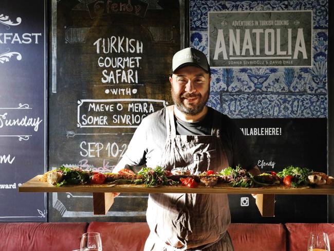 Head chef Burak Cakir with Efendy’s 1m-long Adana Kebab created for International Kebab Day. Picture: Jennifer Soo