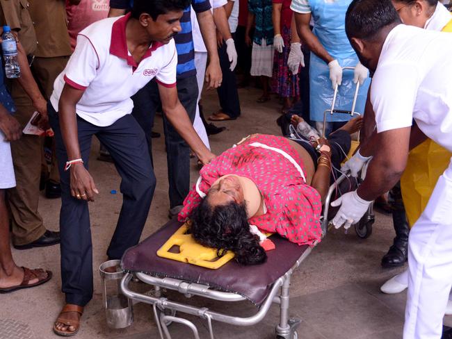 An injured Sri Lankan woman lays on a stretcher following an explosion at St Sebastian's Church, on April 21, 2019. Picture: AFP