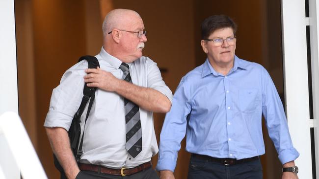 Former NT Police Officer Gordon McDonagh [left] and NT Police Sergeant Ian Gray both gave evidence in the rape trial of former top cop Peter Bravos on Wednesday.