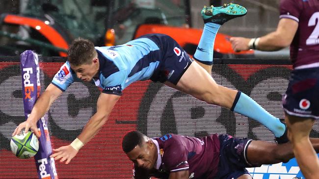 NSW player Alex Newsome dives over for a try at the Sydney Cricket Ground