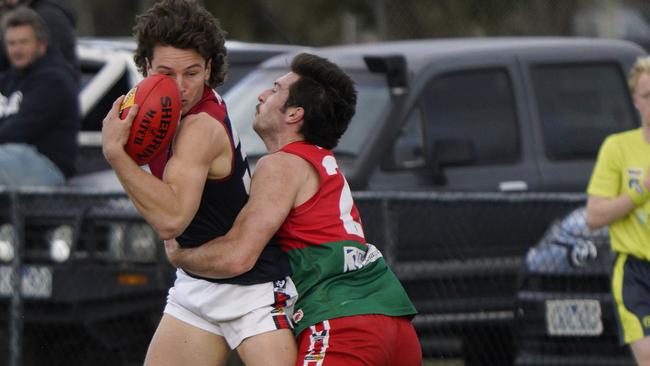 MPNFL: Mt Eliza’s Lachlan Williams is tackled by Max Urwin of Pines. Picture: Valeriu Campan