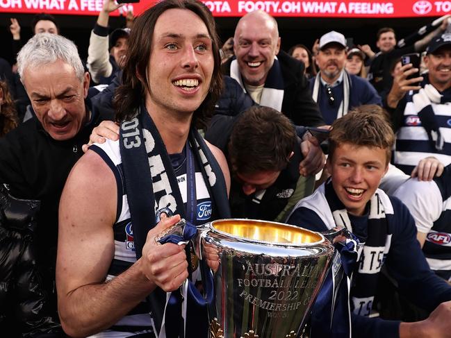 MELBOURNE, AUSTRALIA - SEPTEMBER 24: Jack Henry of the Cats celebrates with fans after winning the 2022 AFL Grand Final match between the Geelong Cats and the Sydney Swans at the Melbourne Cricket Ground on September 24, 2022 in Melbourne, Australia. (Photo by Cameron Spencer/AFL Photos/via Getty Images)