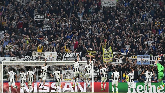 Juventus' players celebrate with fans after winning the UEFA Champions League quarter final first leg.