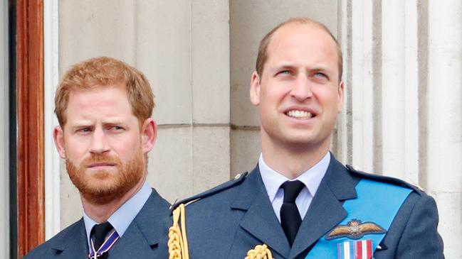 LONDON, UNITED KINGDOM - JULY 10: (EMBARGOED FOR PUBLICATION IN UK NEWSPAPERS UNTIL 24 HOURS AFTER CREATE DATE AND TIME) Prince Harry, Duke of Sussex and Prince William, Duke of Cambridge watch a flypast to mark the centenary of the Royal Air Force from the balcony of Buckingham Palace on July 10, 2018 in London, England. The 100th birthday of the RAF, which was founded on on 1 April 1918, was marked with a centenary parade with the presentation of a new Queen's Colour and flypast of 100 aircraft over Buckingham Palace. (Photo by Max Mumby/Indigo/Getty Images)