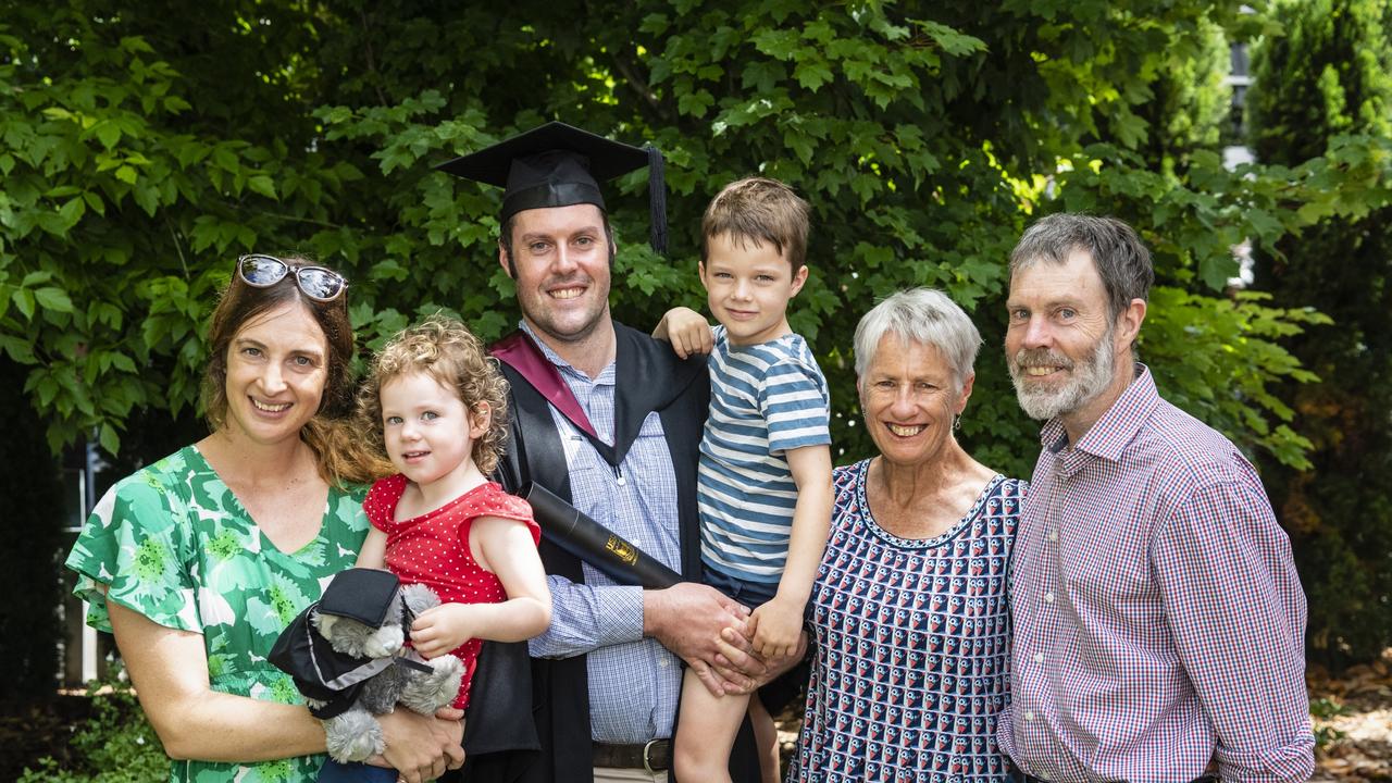 Bachelor of Spatial Science Technology (Surveying) (Honours) graduate Lewis Sweet with family (from left) Jamie Newborn holding Matilda Sweet, Arthur Sweet, Francis Slattery and Stephen Sweet at the UniSQ graduation ceremony at Empire Theatres, Tuesday, December 13, 2022. Picture: Kevin Farmer