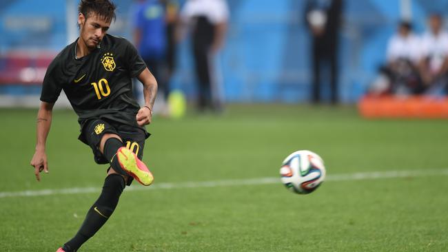 Brazil's forward Neymar kicks a ball during a training session at the Corinthians Arena in Sao Paulo.