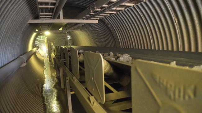 Ore travels along a conveyor belt from the crusher to the sag mills at Saracen’s Thunderbox gold mine. Picture: Bloomberg