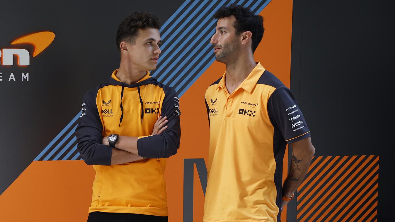 MIAMI, FLORIDA - MAY 05: Lando Norris of Great Britain and McLaren and Daniel Ricciardo of Australia and McLaren talk in the Paddock during previews ahead of the F1 Grand Prix of Miami at the Miami International Autodrome on May 05, 2022 in Miami, Florida. (Photo by Jared C. Tilton/Getty Images)