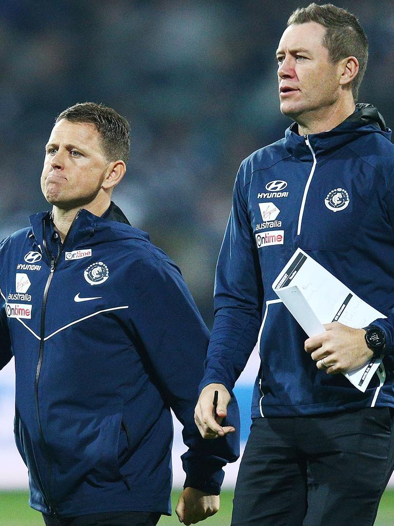 Barker and former Blues head coach Brendon Bolton in 2018. Picture: Getty