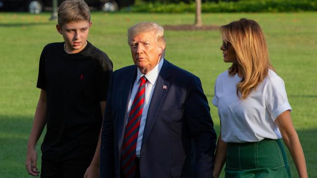 Melania and Barron Trump with Donald Trump. Picture: AFP.