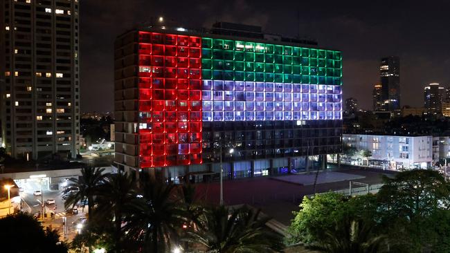 City hall in Tel Aviv is lit up in the colours of the United Arab Emirates national flag on Thursday night. Picture: AFP