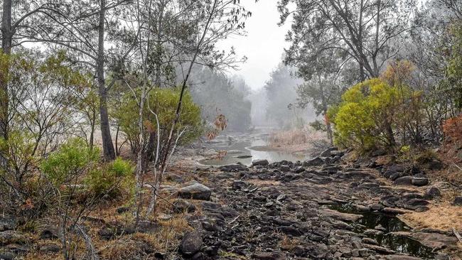 NO WATER: Sandy Creek below Leslie Dam wall is no more than a trickle in June 2018. Picture: Jodie Locke