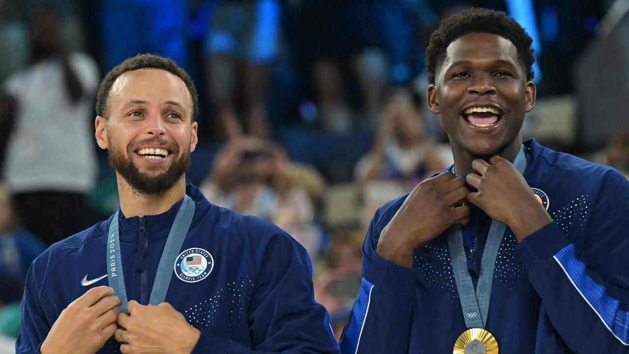 Edwards (right) won an Olympic gold medal in Paris alongside Steph Curry and Team USA. (Photo by Damien MEYER / AFP)