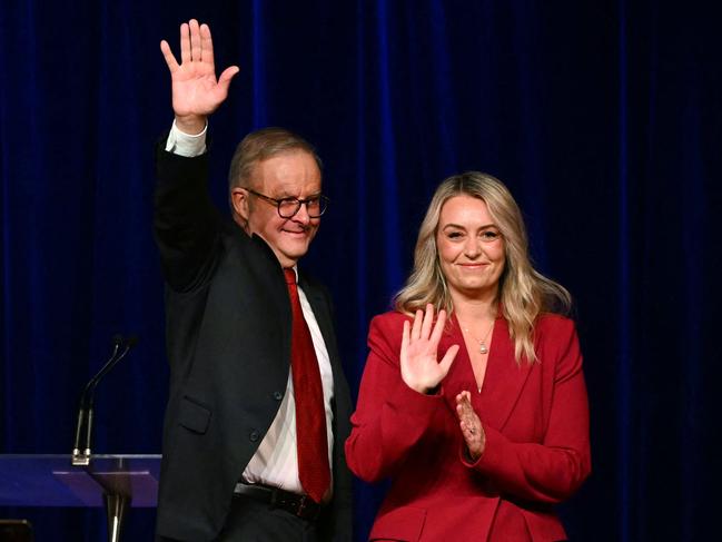Prime Minister Anthony Albanese waves beside his partner Jodie Haydon. Picture Saeed Khan / AFP