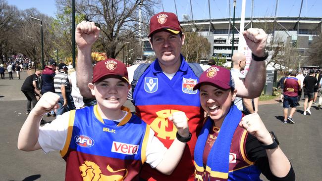 Ethan, Brendan and Kelle Hope are backing the Lions. Picture: Andrew Henshaw