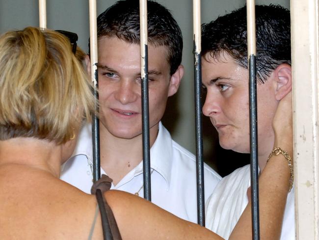 Rush and Renae Lawerence in holding cells after they were sentenced to life in prison in 2006.