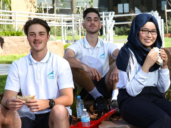 Craigieburn Secondary students will eat lunch at 11.30am with a 45 minute break and have recess in the afternoon so as to give them more time to fuel up early and get through the rest of the day. Year 12 students  Kade , Elia , Rabia , Fay and Carol eat lunch. Picture : Ian Currie