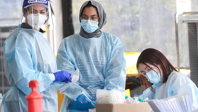 Testers at a testing site in Tarneit. Picture: Ian Currie