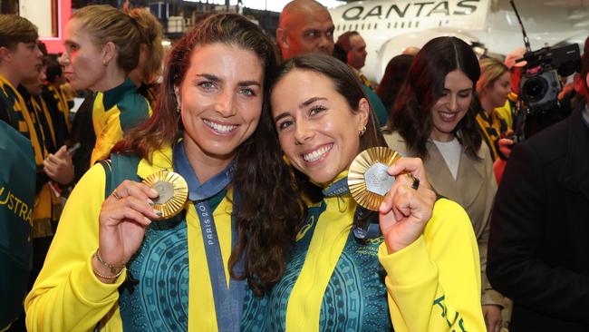 Sisters Jess and Noemie Fox share a golden moment. Picture: Rohan Kelly